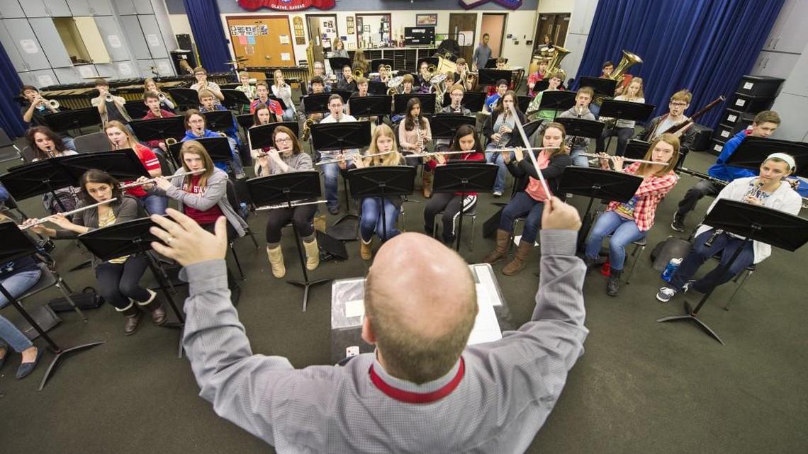 Programs that benefit students such as these in the Olathe North High School band are part of the battle over how much money the state spends on Kansas schools.