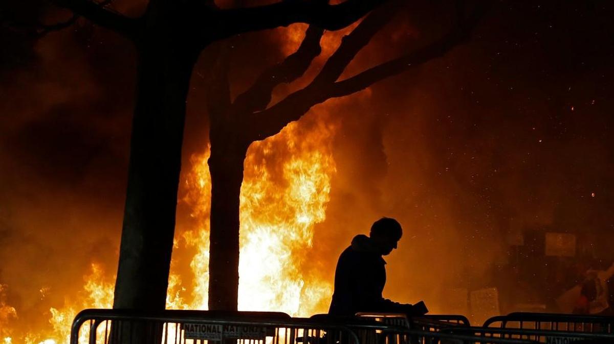 A fire set by demonstrators protesting a scheduled speaking appearance by Breitbart News editor Milo Yiannopoulos burned on Sproul Plaza on the University of California, Berkeley campus on Feb. 1, 2017.