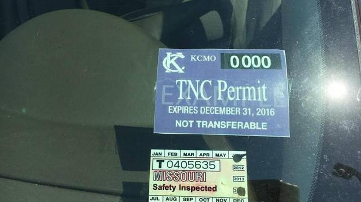 Uber drivers receive purple stickers showing they have vehicle permits from Kansas City officials.
