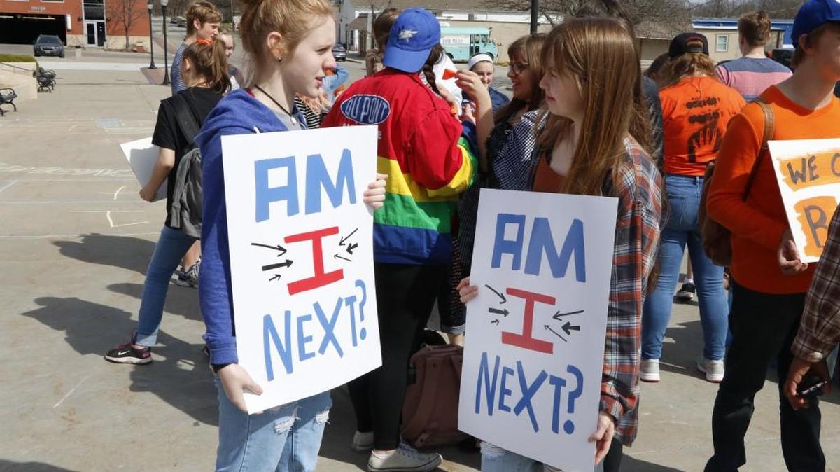 Lee's Summit High School senior Zoe Balistreri (left) and sophomore Abbey Lewis took part in a National School Walkout rally in front of City Hall.