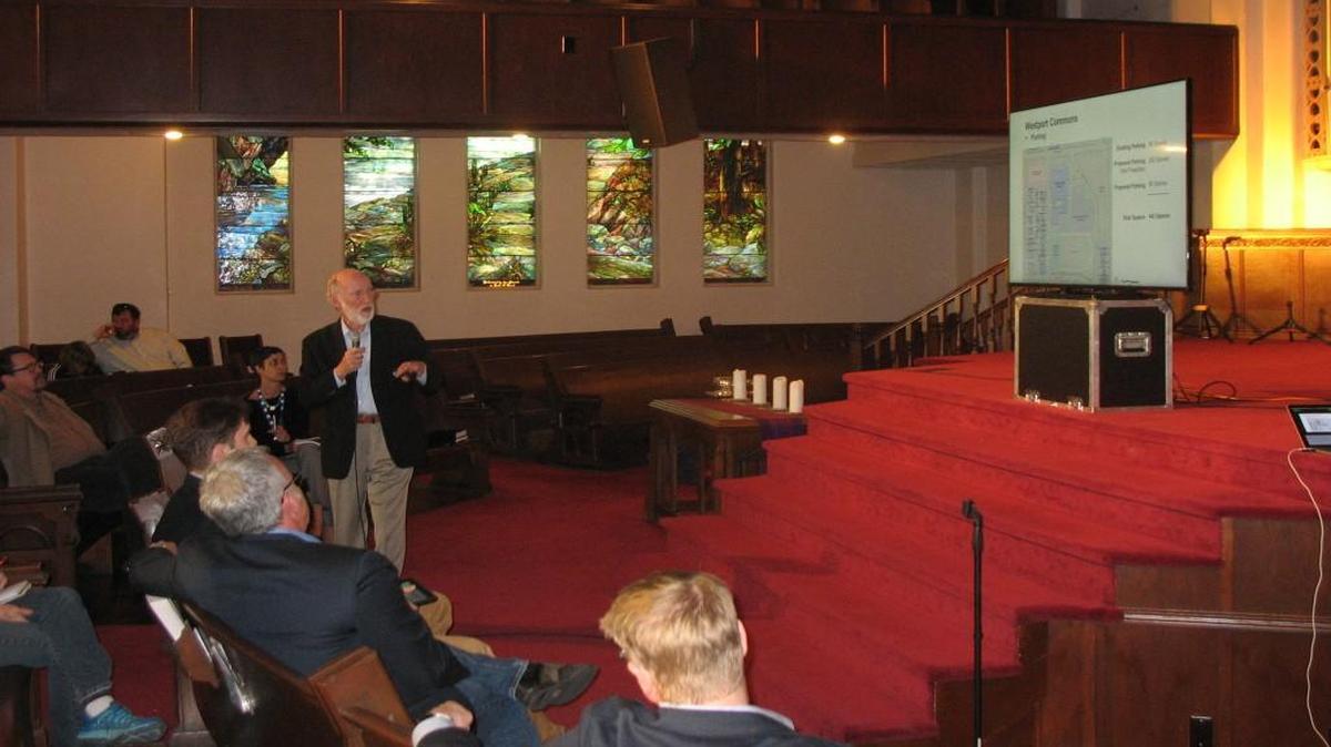 Bob Berkebile, a principal of BNIM architects and a lead partner in the proposed Westport Commons project, explained Monday night to an audience at Redeemer Fellowship the plans for the shuttered Westport High School and Westport Middle School. Kansas City Sustainable Development Partners wants the school board to lift a 20-year restriction on the use of an athletic field in back of the high school for parking.