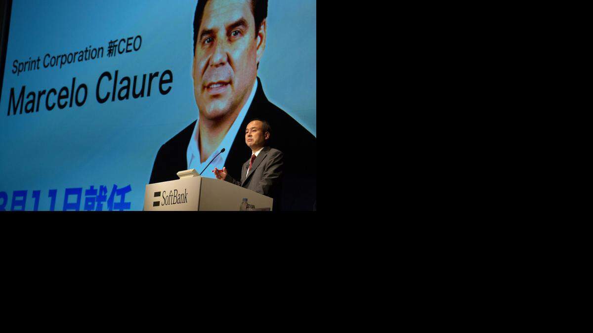 
Masayoshi Son, chairman and chief executive officer of SoftBank, spoke in front of an image of incoming Sprint chief executive officer Marcelo Claure during a news conference in Tokyo. 
