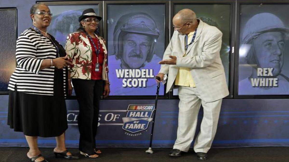 
Wendell Scott Jr. (right), Mable Scott (left) and Deborah Davis (center) posed for photos after Wendell Scott was named one of five inductees into the NASCAR Hall of Fame class of 2015 during an announcement in Charlotte, N.C., in 2014. 
