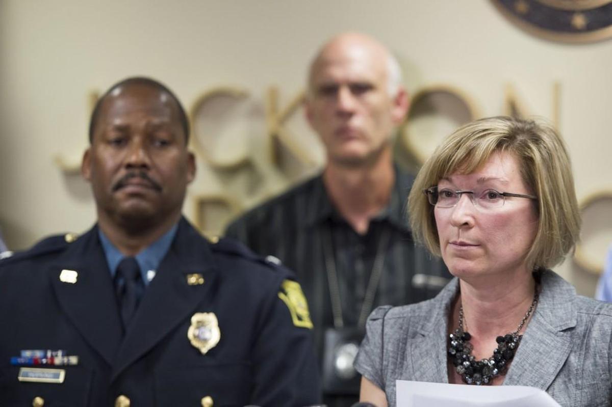 In this file photo, Randy Hopkins, a former Kansas City deputy chief, stands with Jackson County Prosecutor Jean Peters Baker.
