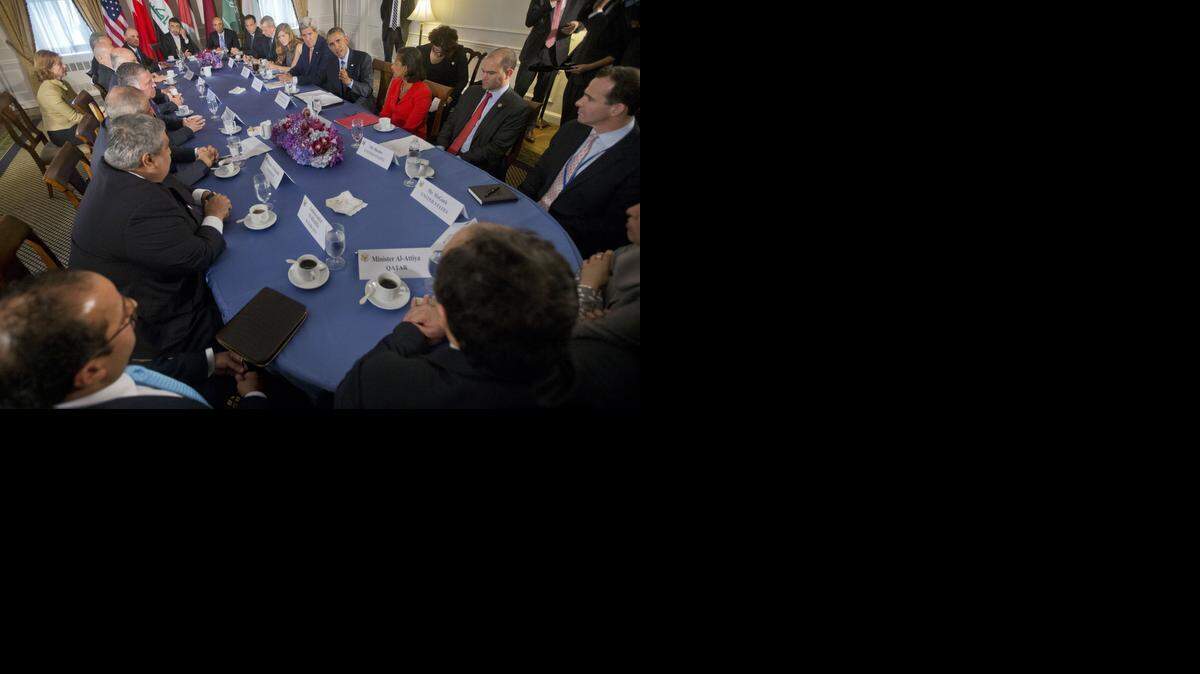 
President Barack Obama, Secretary of State John Kerry and other officials meet with the representatives of Bahrain, Qatar, Saudi Arabia, Jordan, United Arab Emirates and Iraq in New York on Tuesday after the U.S. and five Arab nations participated in strikes against Islamic State targets in Syria.
