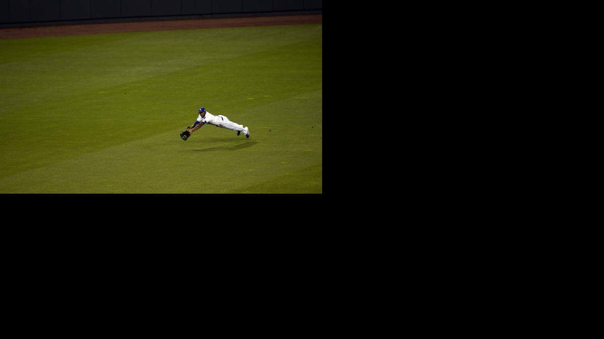 
Lorenzo Cain makes a diving catch on a ball hit by Los Angeles Angels shortstop Erick Aybar.
