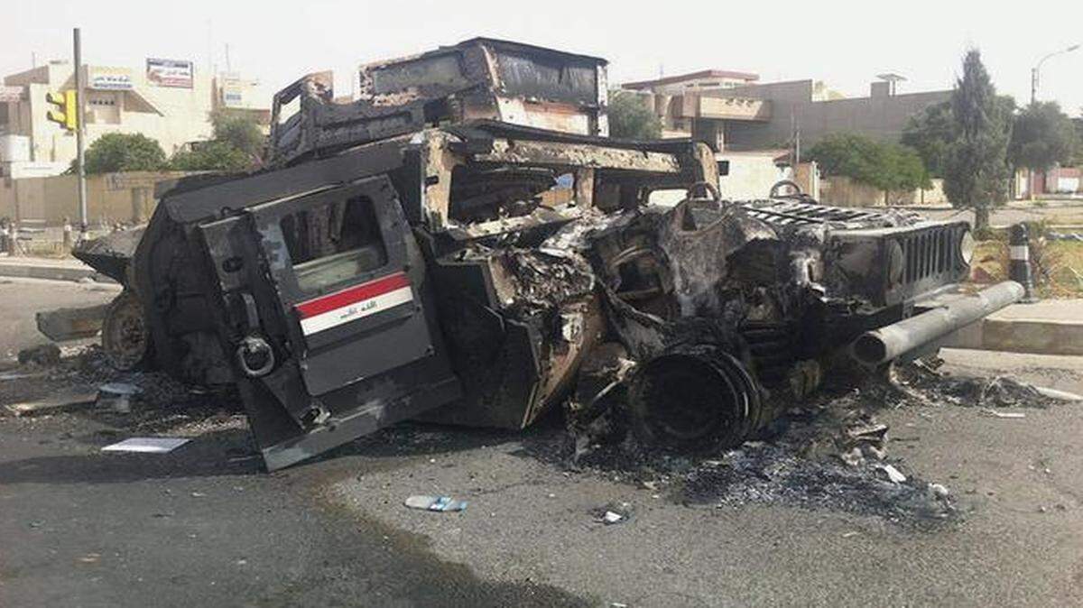 An Iraqi army armored vehicle was burned during an assault by insurgents this week in Mosul, Iraq.