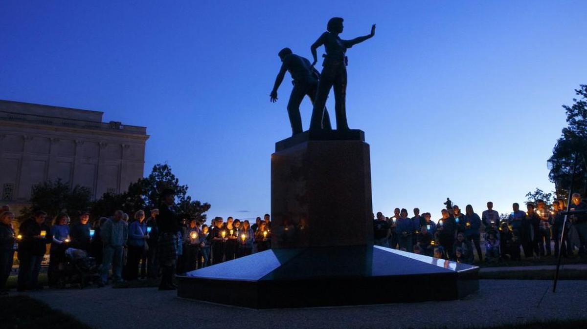 
A candlelight vigil at the Illinois Police Officers Memorial in Springfield honors fallen officers. 
