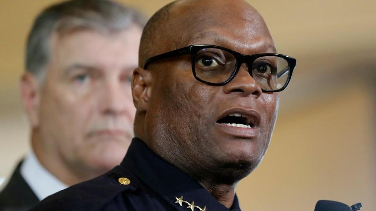 Faces of leadership: Dallas Police Chief David Brown (front) and Mayor Mike Rawlings earned praise for their media appearances Thursday and Friday.