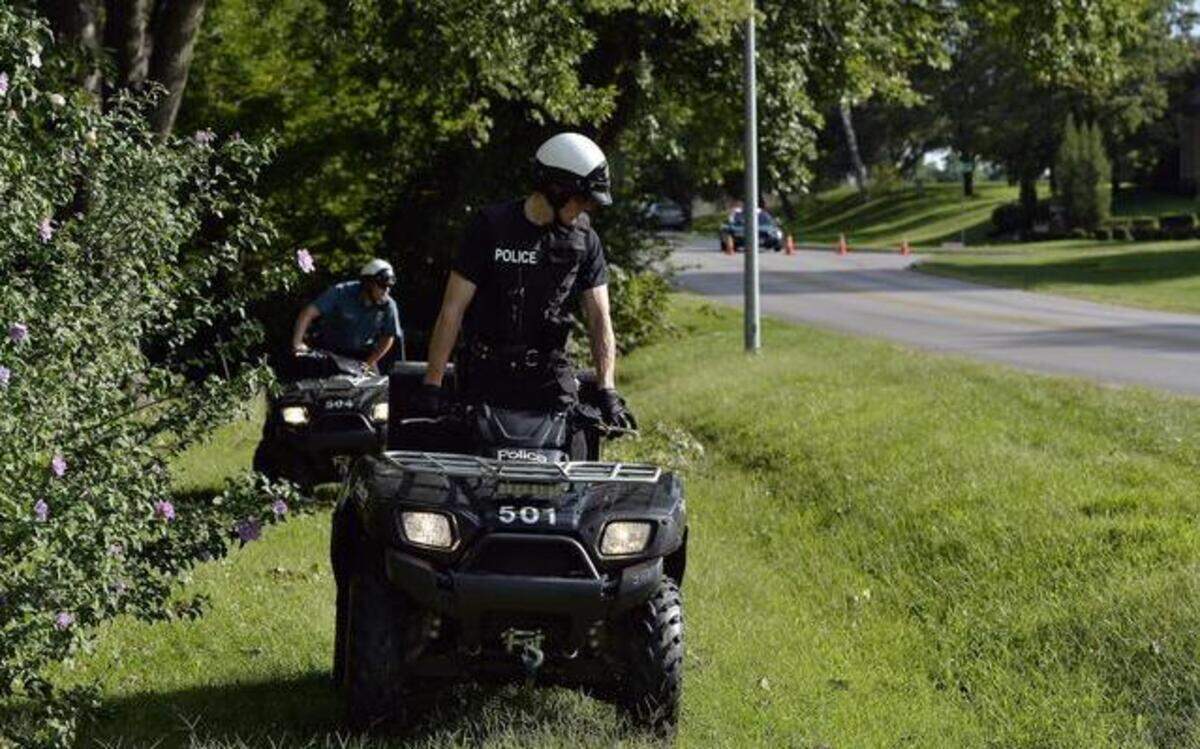 
Police on ATVs searched the side of Wornall Road on Sept. 2 after an assailant fatally wounded five people on Woodbridge Lane in south Kansas City. Brandon Howell is awaiting trial in the deaths. 
