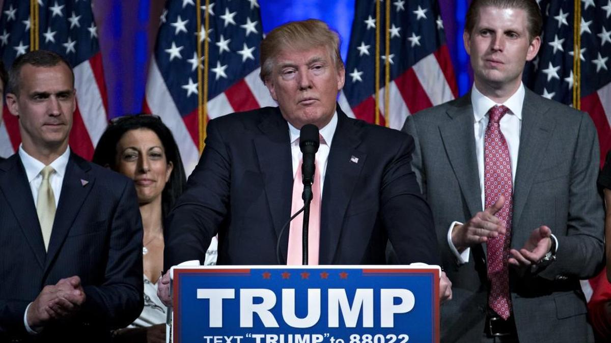 Donald Trump spoke after winning the Florida GOP presidential primary on Tuesday night. His appearance featured campaign manager Corey Lewandowski (left), who has been accused of grabbing a female reporter at a recent event.