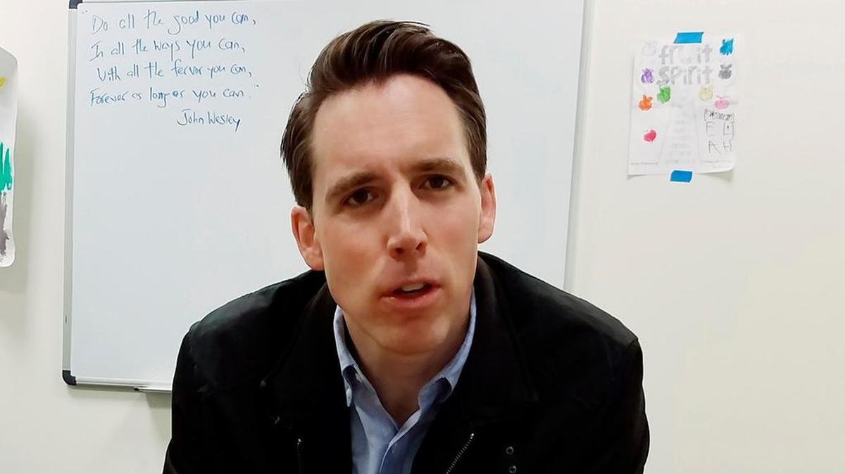 In this March 28, 2018 photo, Republican U.S. Senate candidate Josh Hawley, of Missouri, speaks at his Columbia, Mo., campaign office. Hawley is among the Republican Party's most-prized recruits, but things get complicated if you ask the Missouri Republican Senate candidate about President Donald Trump. Hawley supports the president's policies but sidesteps questions about his behavior. (AP Photo/Summer Ballentine)