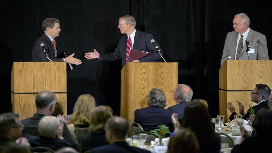 At a debate in September 2014 in Overland Park, Gov. Sam Brownback (left) supposedly was in trouble in his re-election race against Democrat Paul Davis (middle). Libertarian Keen Umbehr also was at the event. Brownback took the most votes in the county and across the state in the November general election.