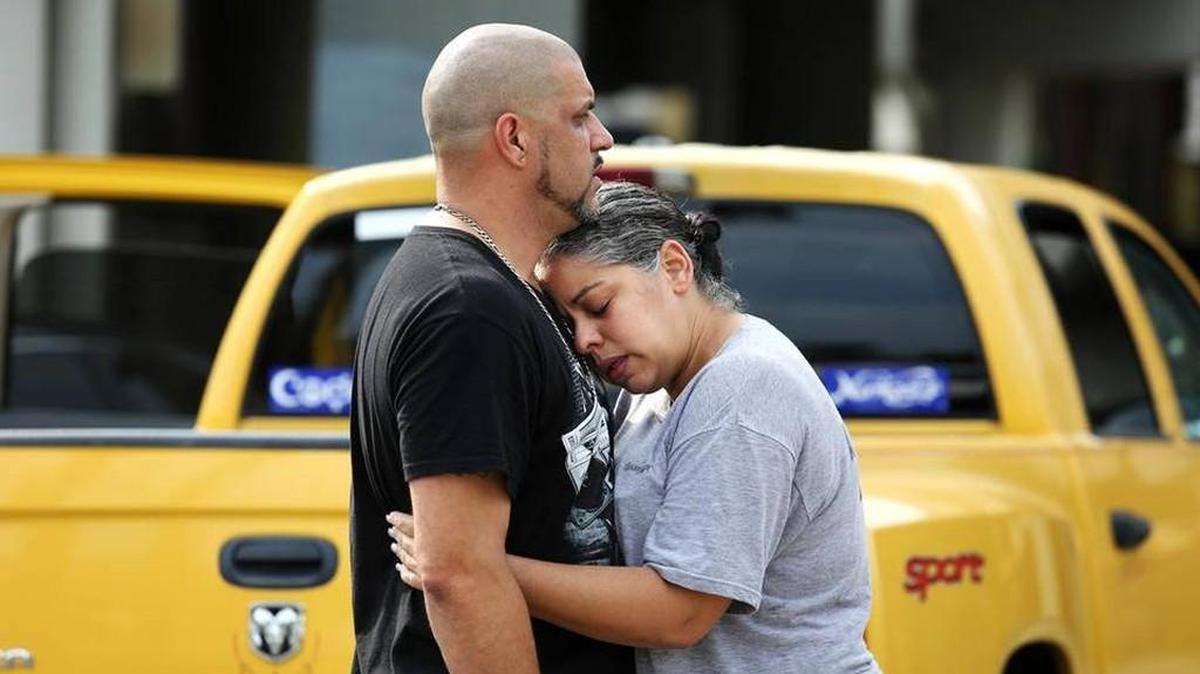 Ray Rivera, a DJ at a gay nightclub in Orlando, was consoled by a friend after the worst mass shooting in U.S. history killed at least 50 people Sunday morning.