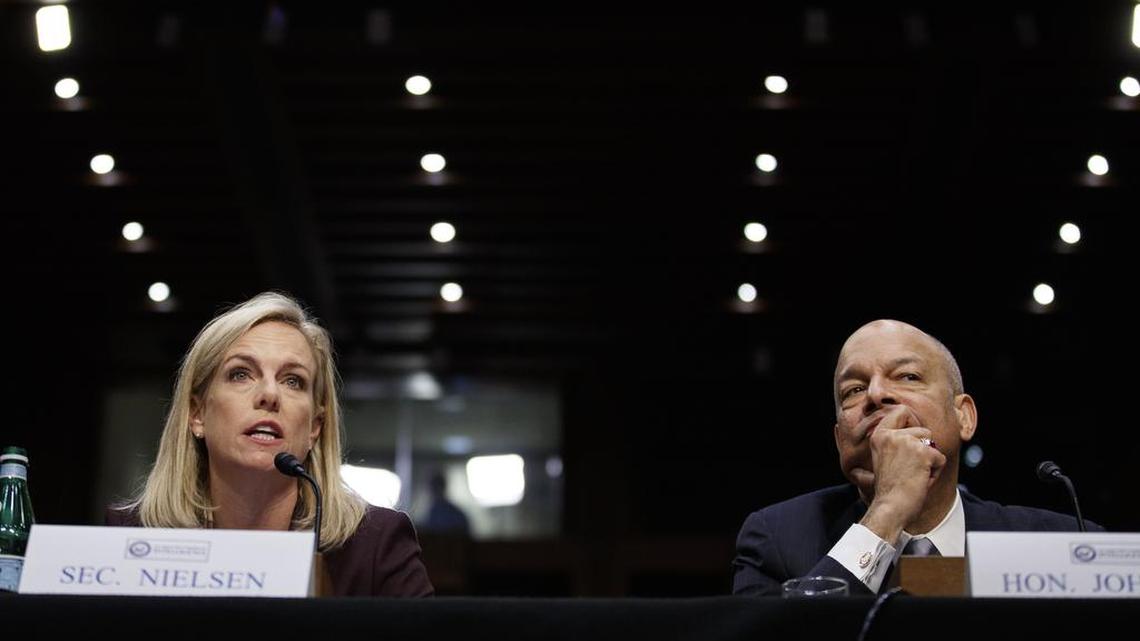 Homeland Security Secretary Kirstjen Nielsen, left, joined by former Homeland Security Secretary Jeh Johnson, right, speaks before a Senate Intelligence Committee hearing on election security on Wednesday.