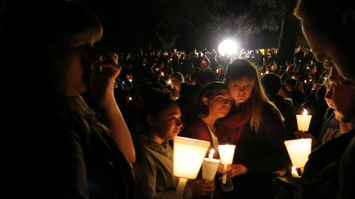 
People attended a candlelight vigil at Stewart Park for those killed in Roseburg, Ore.
