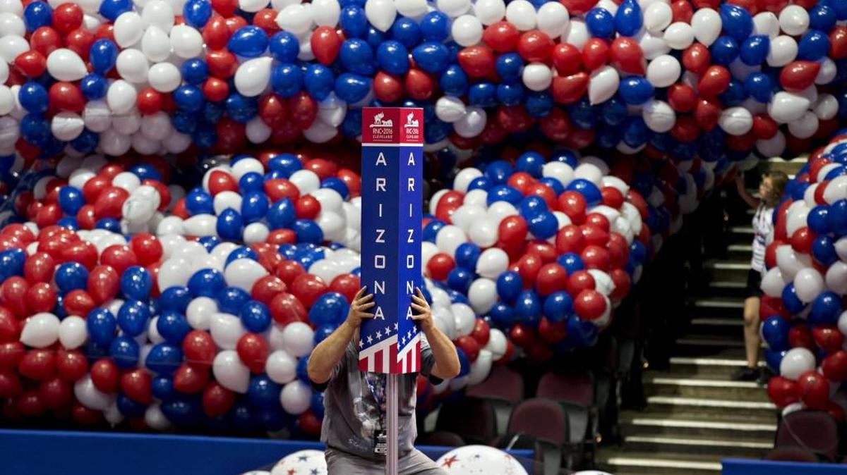 A worker installed a state placard inside the Quicken Loans Arena in Cleveland ahead of the Republican National Convention.