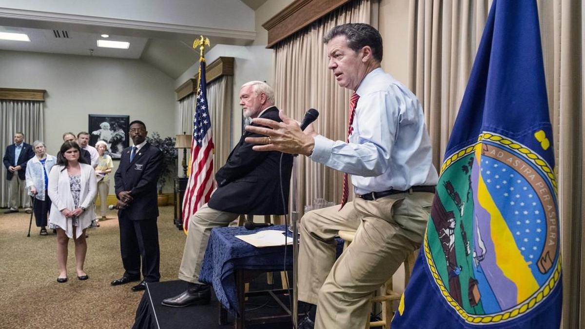 
Citizens lined up to tell Kansas Gov. Sam Brownback what they thought about transferring Guantánamo Bay detainees to Fort Leavenworth.
