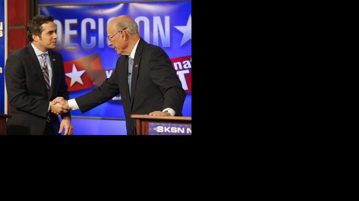 
Independent Senate candidate Greg Orman, left, and Republican Sen. Pat Roberts shake hands after concluding a debate earlier this month in Wichita. 

