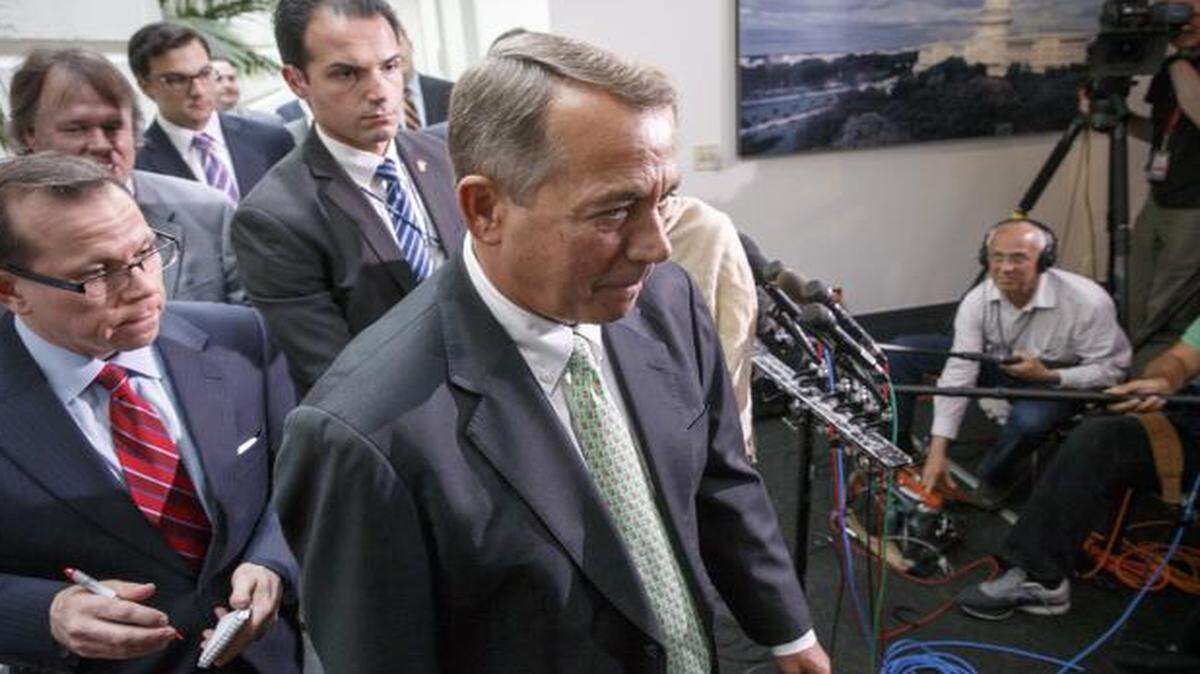 
Speaker of the House John Boehner walks past reporters following a closed-door meeting of House Republicans on Capitol Hill in Washington last Friday to discuss the border crisis.
