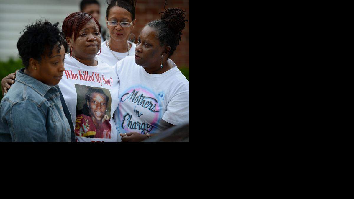 
During a vigil last year to commemorate the death of her son, Rosilyn Temple (middle) was comforted by other mothers whose sons have been lost to violence. From left are Dewana O’Guinn, Cheryl Lumpkins and Sonya Cherry. 
