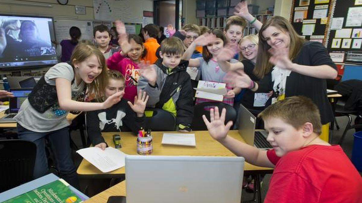 
Educators like fifth-grade teacher Micaela Kazanowski (standing at far right) will have a tougher job ahead to raise student test scores to maintain state accreditation. The students are at Graden Elementary School in Parkville in the Park Hill School District.
