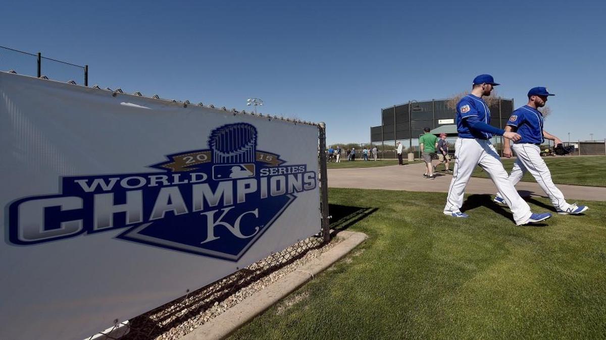 A sign proclaiming the Kansas City Royals as World Series champions greets players at the team’s spring training complex in Surprise, Ariz.