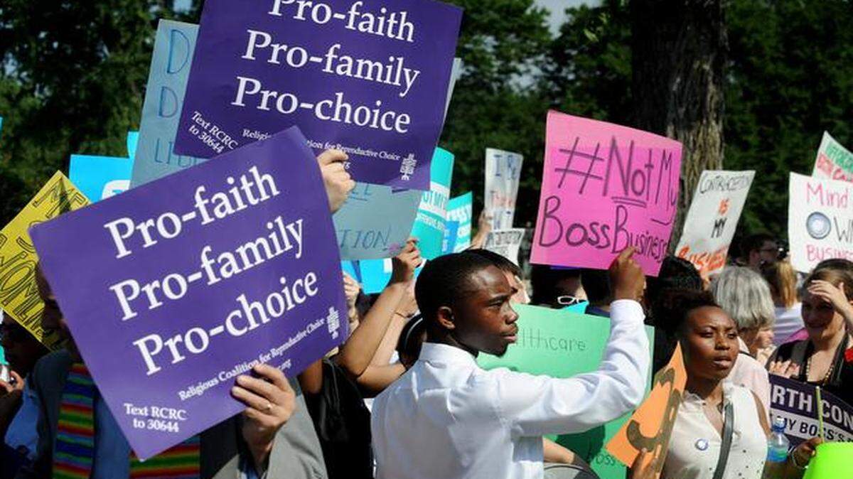 
Demonstrators reacted to the Hobby Lobby decision on Monday outside the U.S. Supreme Court.
