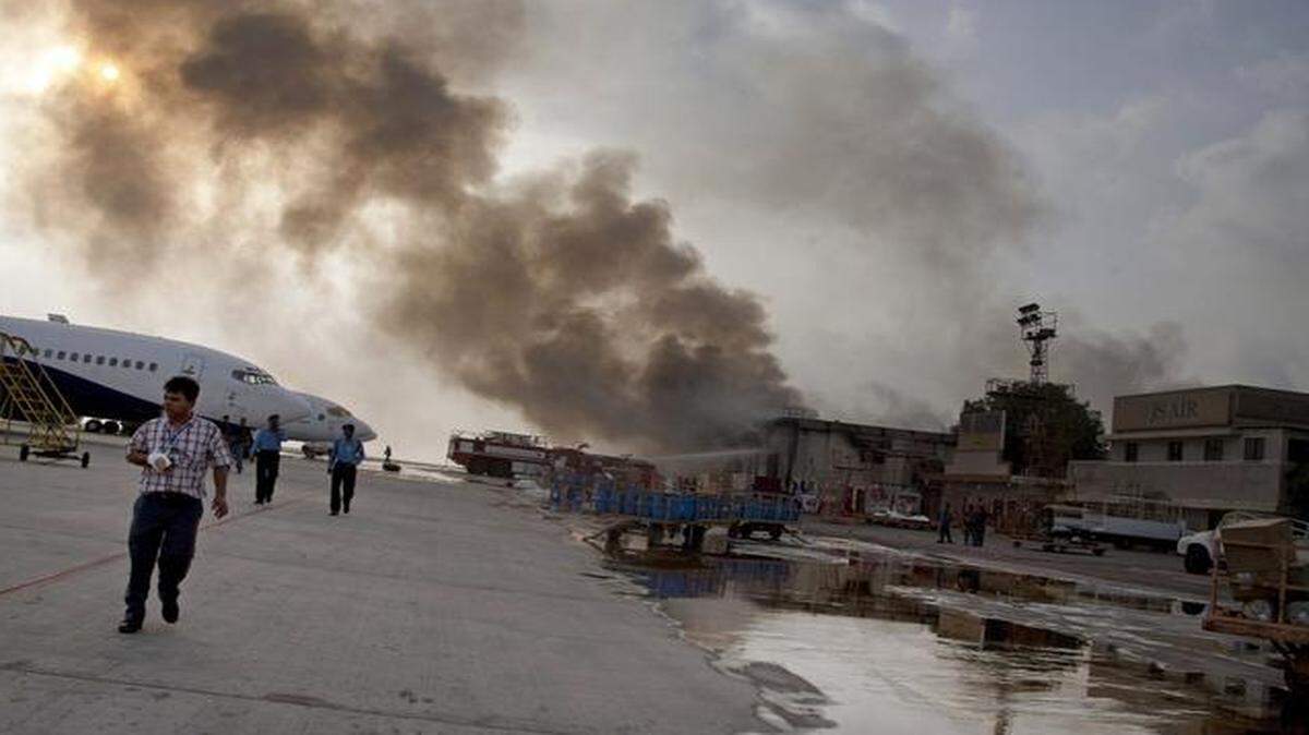 
Smoke rises above Jinnah International Airport, where security forces battled militants in Karachi, Pakistan.
