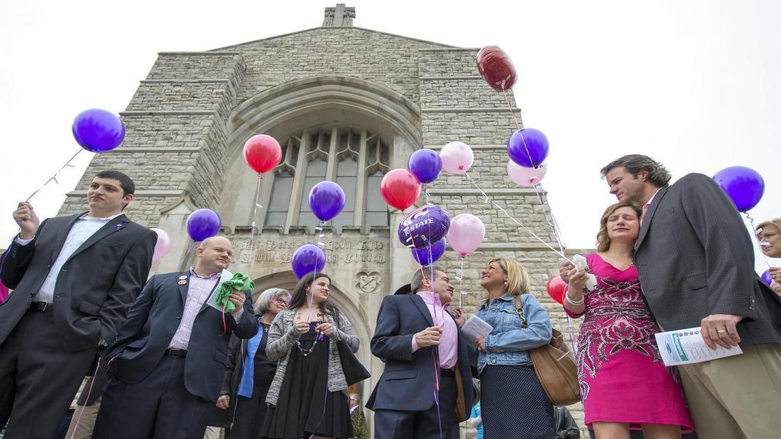 
Family and friends of victims Terri LaManno, Reat Underwood and William Corporon gathered on the first anniversary of the fatal shootings for a memorial Mass and balloon release in their honor. 
