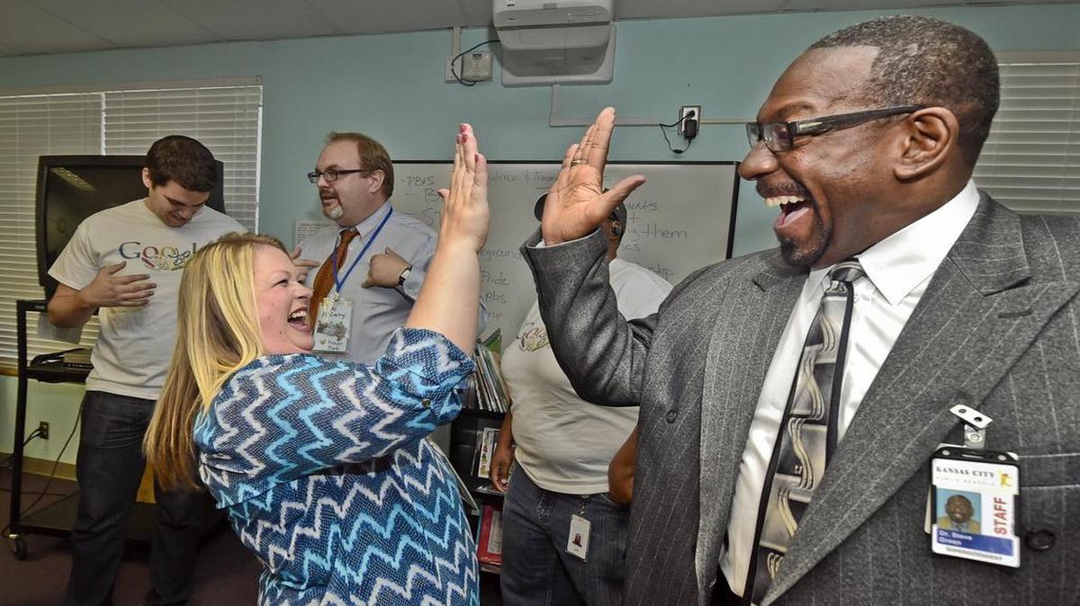 
Annette Rhinehart, a teacher at Garfield Elementary School, high-fived Kansas City superintendent Steve Green last September after it was learned that the school would share in a Google-sponsored crowdfunding project.
