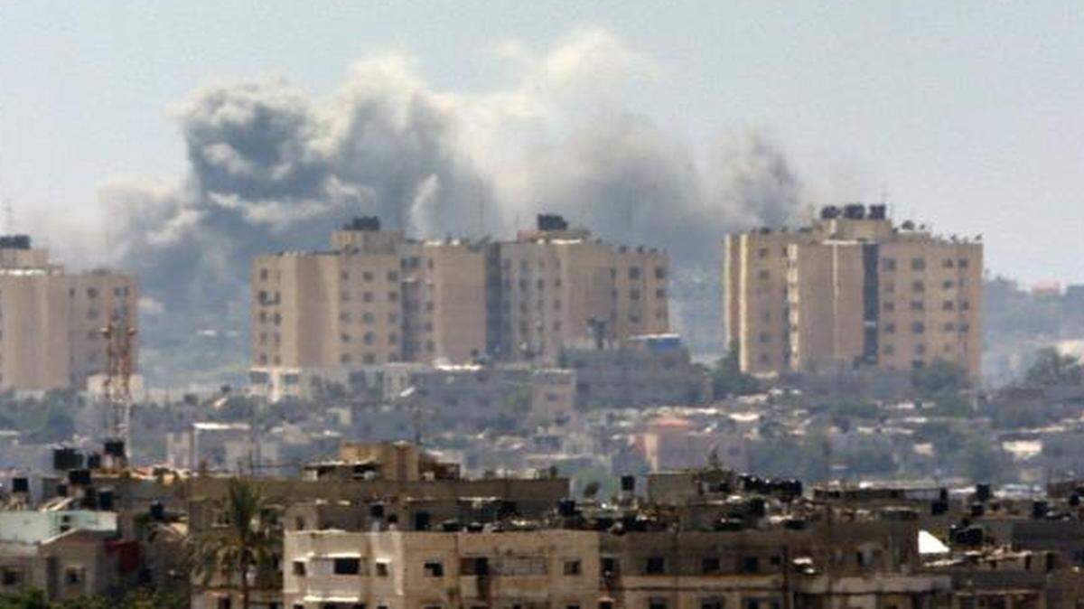 
Smoke rises following an Israeli strike on Gaza Thursday, seen from the Israel-Gaza Border.
