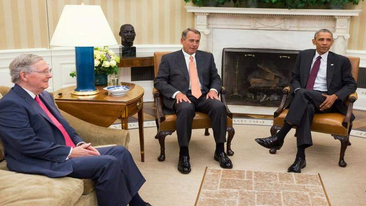 
Mitch McConnell (left) and John Boehner (center) will disagree often with Barack Obama in 2015.
