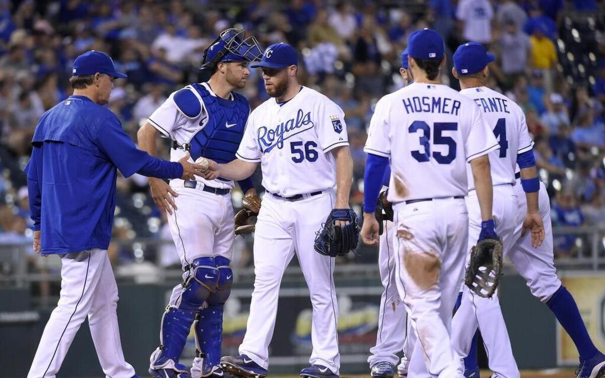 
Kansas City Royals relief pitcher Greg Holland (56) is relieved by manager Ned Yost in the ninth inning during Thursday's baseball game against the Los Angeles Angels on August 13, 2015 at Kauffman Stadium in Kansas City, Mo.
