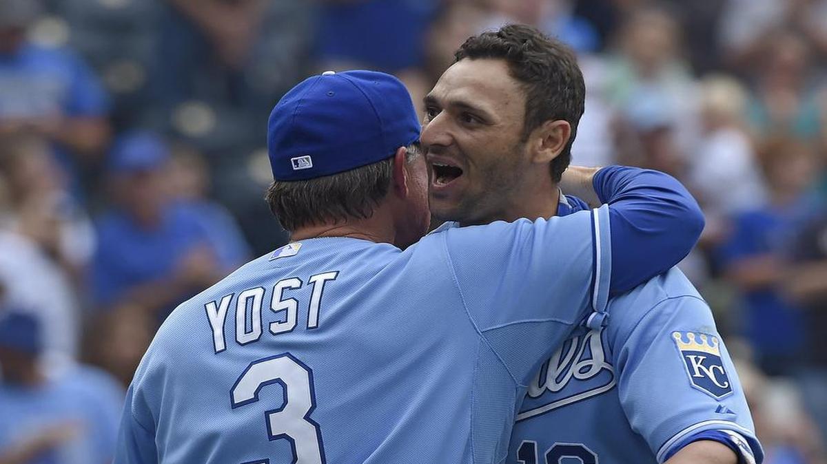 
Royals manager Ned Yost (3) gives Paulo Orlando a hug after his ninth-inning grand slam for a 9-5 win lifted KC over the Tampa Bay Rays on July 7 at Kauffman Stadium. Star sportswriter Andy McCullough thinks Orlando would be among the first of the Royals’ September call-ups.
