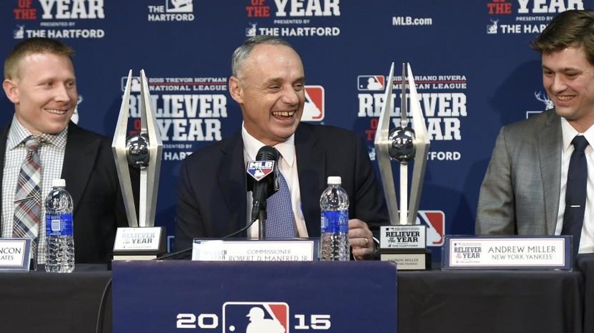 Baseball Commissioner Robert Manfred (center) shareed a laugh with Pittsburgh Pirates pitcher Mark Melancon (left) and New York Yankees pitcher Andrew Miller before the start of Wednesday’s World Series game at Kauffman Stadium. Melancon was selected the top relief pitcher in teh National League, and Miller won the honor in the American League.