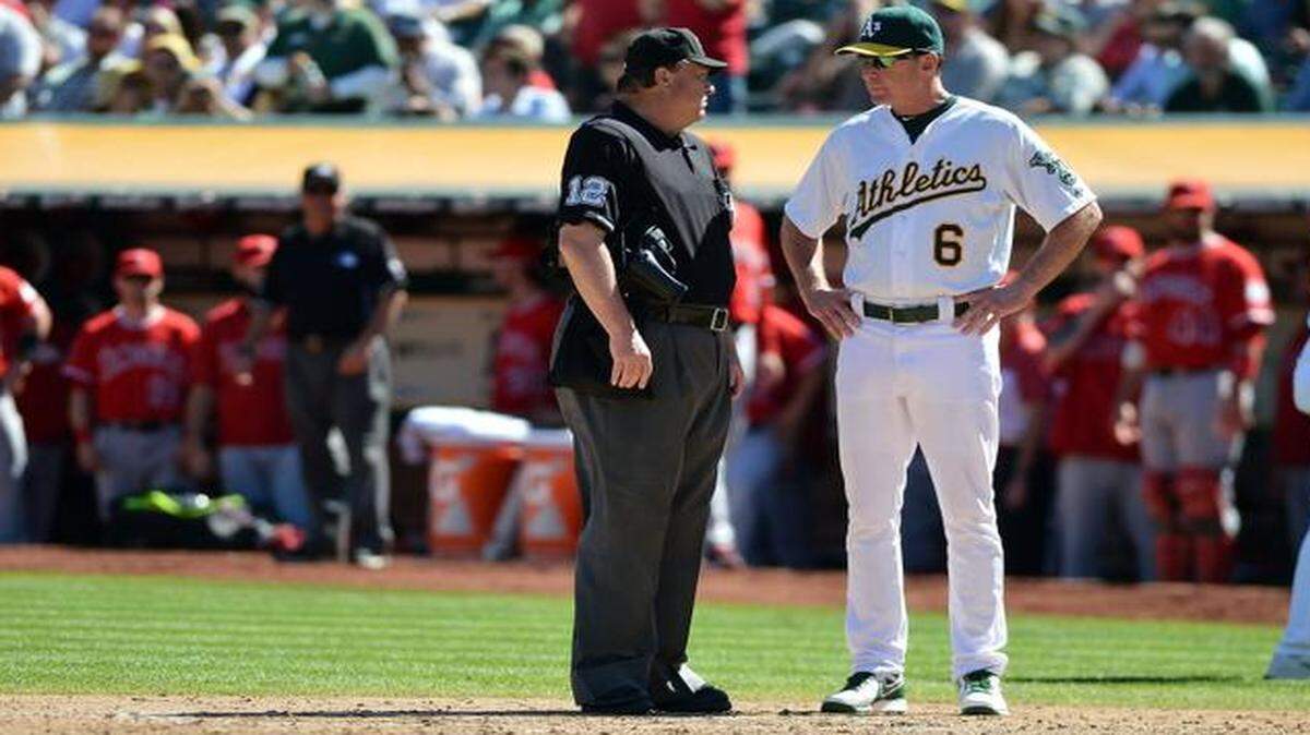 
Oakland Athletics manager Bob Melvin talked with home plate umpire Gerry Davis before appealing a play at the plate during the fourth inning of their game against the Los Angeles Angels on Sept. 24.
