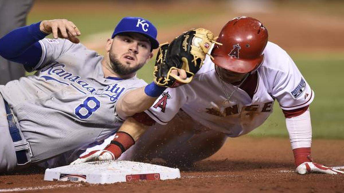 
Royals third baseman Mike Moustakas tagged out Angels right fielder Collin Cowgill for a double play during their Oct. 3 ALDS baseball game in Anaheim, Calif.
