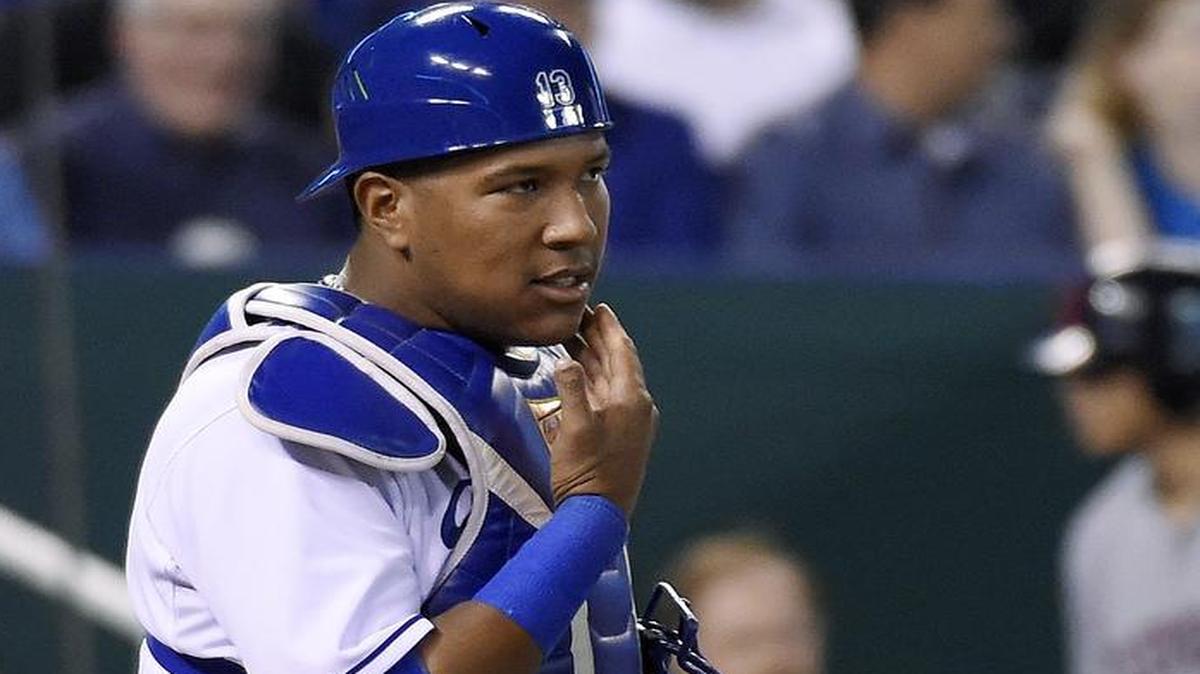 
Kansas City Royals catcher Salvador Perez (13) checks his jaw after being hit in the mask by a foul tip off the bat of Cleveland Indians' Yan Gomes in the seventh inning during Tuesday's baseball game on June 2, 2015 Kauffman Stadium in Kansas City, Mo.
