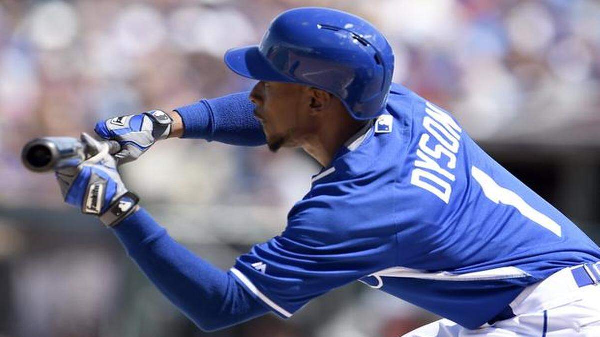 
Royals outfielder Jarrod Dyson lays down a bunt against the Cubs during a spring training baseball game last month in Surprise, Ariz.
