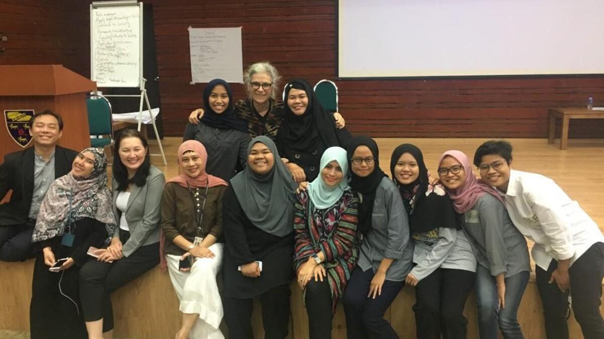 Joanne Katz (back row, center) poses with fellow attendees at a legal conference last September in Kuala Lumpur, Malaysia.