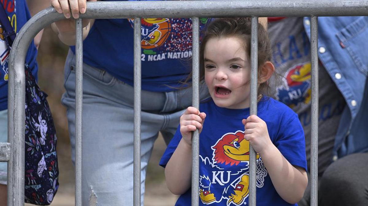 Four-year-old Keller Moore of Lawrence had a nice close spot to watch the Kansas Jayhawks NCAA Championship parade. You don’t have to be on the team to consider yourself part of the University of Kansas family.