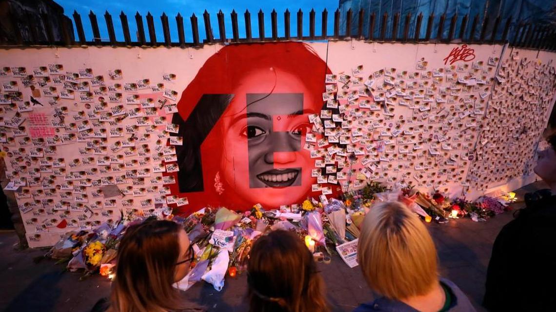 Candle and flowers are placed in front of a mural of Savita Halappanavar in Dublin as Ireland has voted to repeal the 8th Amendment of the Irish Constitution which prohibits abortions unless a mother's life is in danger.