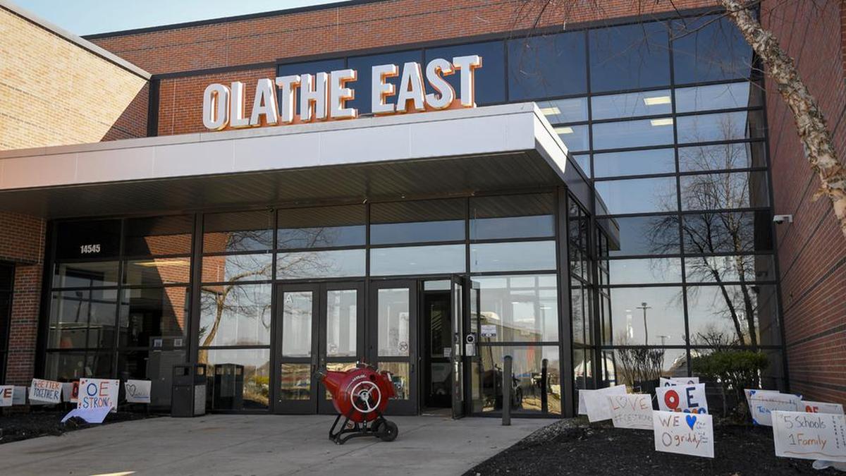 Signs of support were placed outside of Olathe East High School, which was the scene of a shooting on March 4, 2022, that left three people injured and a student charged with attempted capital murder.