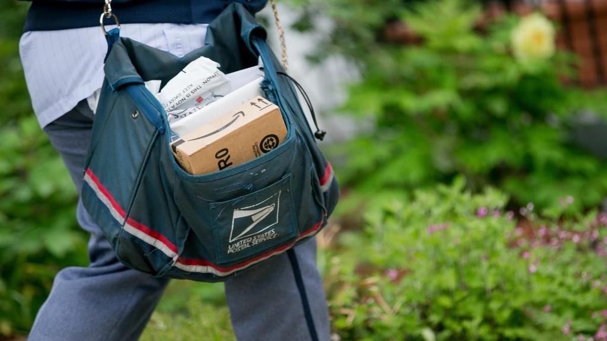 A U.S. Postal Service mail carrier.