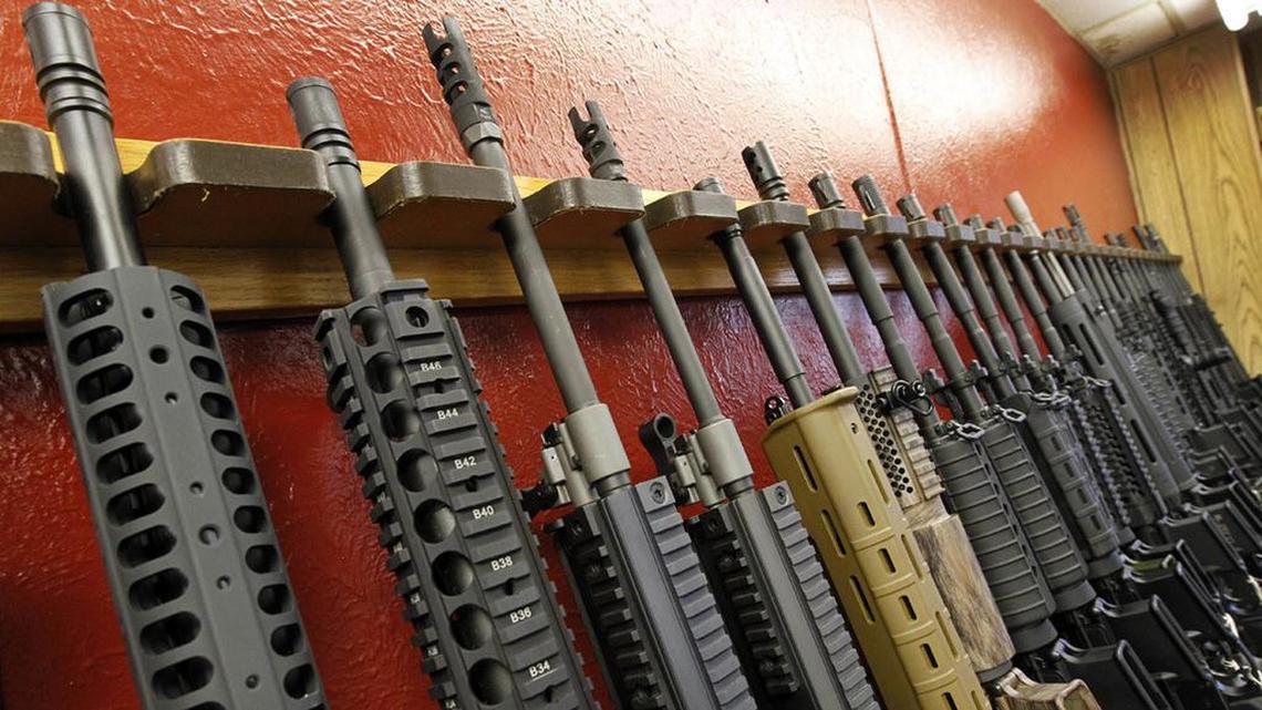 FILE - A row of rifles for sale is on display at a gun shop in Aurora, Colo., on July 20, 2012. (AP Photo/Alex Brandon, File)
