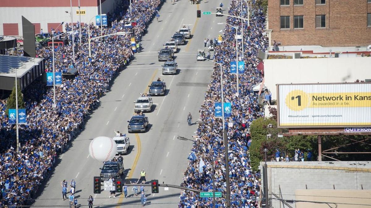 Large crowds lined Grand Boulevard for a victory parade honoring the World Series champion Kansas City Royals.