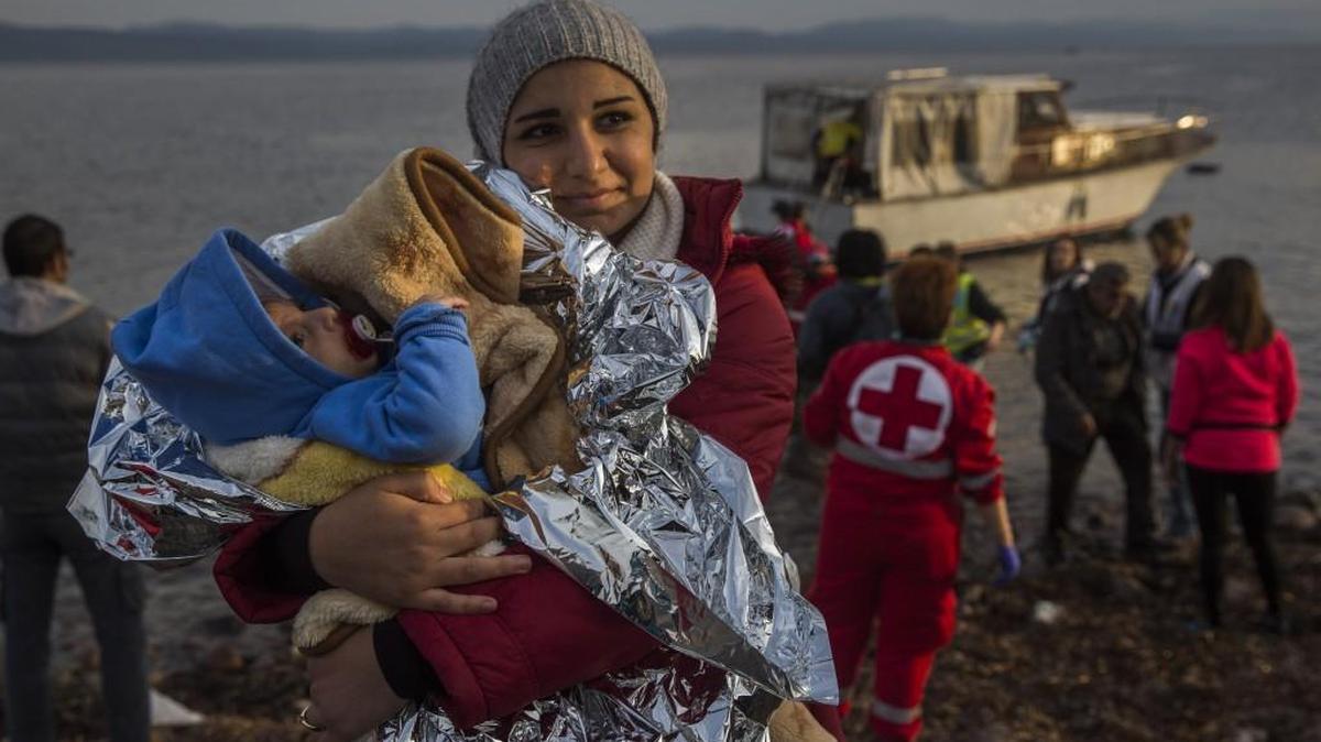 Syrian migrants such as this mother and baby might find it more difficult to receive sanctuary since the Paris attacks. Kansas Gov. Sam Brownback and many other governors say they will resist resettlement of Syrian refugees in their states.