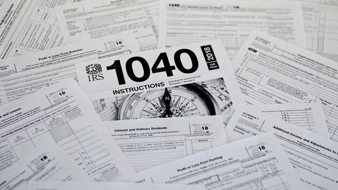 FILE - This photo shows multiple forms printed from the Internal Revenue Service web page in Zelienople, Pa., Feb. 13, 2019. (AP Photo/Keith Srakocic, File)