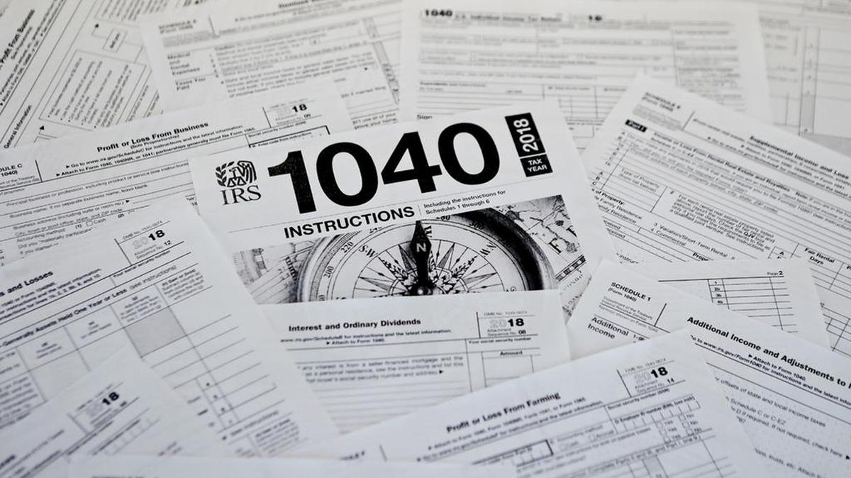 This photo shows multiple forms printed from the Internal Revenue Service web page in Zelienople, Pa., Feb. 13, 2019. The IRS is overburdened and understaffed, which means even the smallest error could delay the processing of your tax return for months. The biggest mistake is opting for paper filing, which could take longer to process and is often more likely to contain errors. (AP Photo/Keith Srakocic, File)
